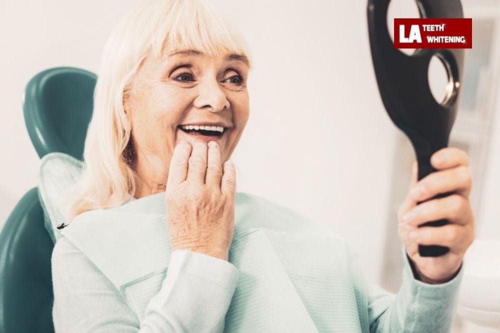 A confident older adult smiling with bright, white teeth after laser whitening St Albans